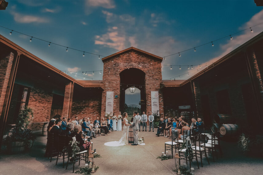 Winery wedding ceremony in the courtyard at the hare wine co in niagara on the lake