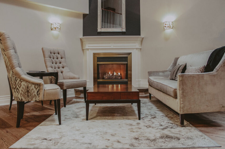 Vintner’s Loft Guest Suite seating area with fireplace at Inn On The Twenty in Jordan Village
