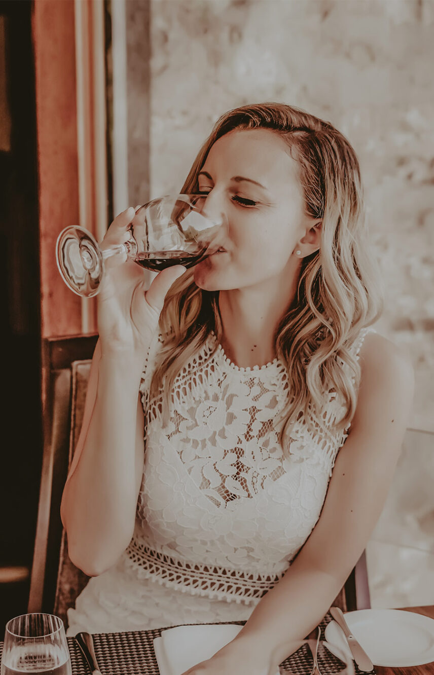 Woman drinking at Headwater Restaurant at Millcroft Inn & Spa