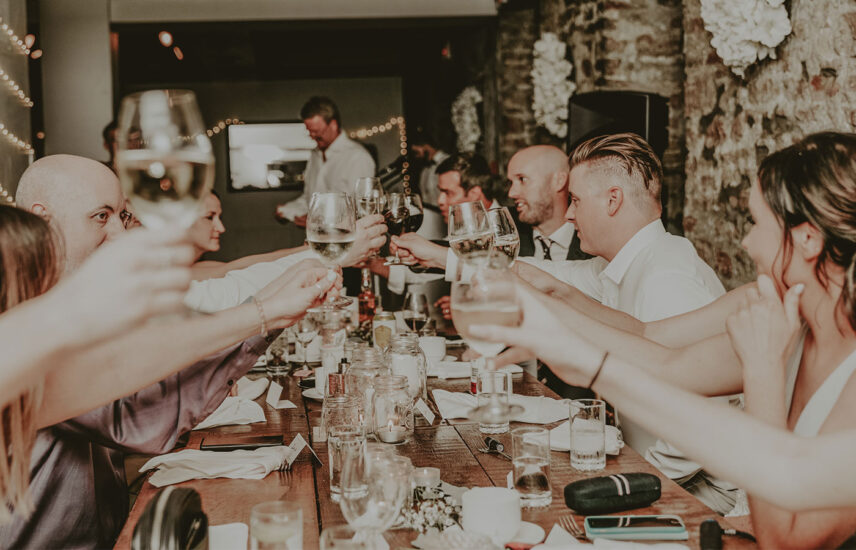 Wedding party rejoices in the River Room wedding venue at Millcroft Inn & Spa in Caledon