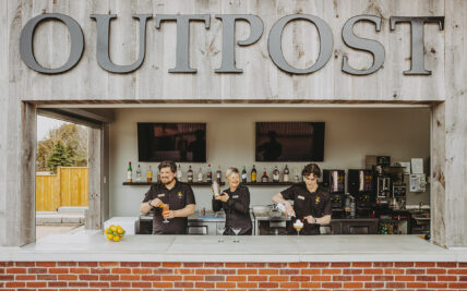 Bartenders serving cocktails at The OutPost at Pillar and Post