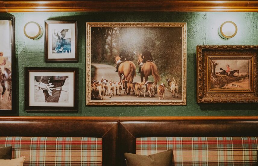 Historic artwork decorating the walls of the Vintage Wine Bar & Lounge at the Pillar & Post Hotel in Niagara-on-the-Lake